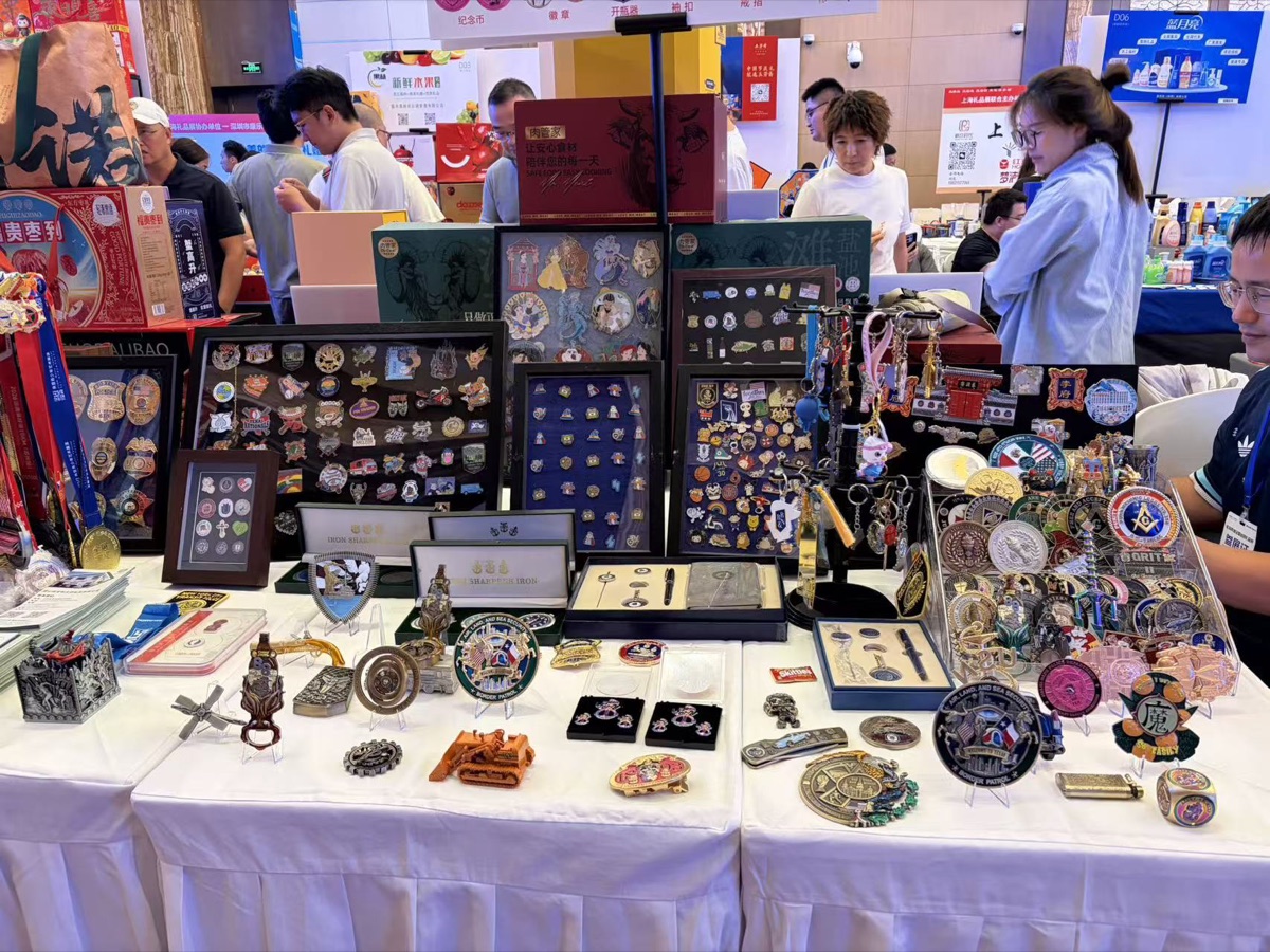 Custom challenge coins, pins, medals and keychains displayed by GT Gifts